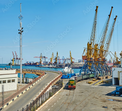 Cargo ships, trains and cranes