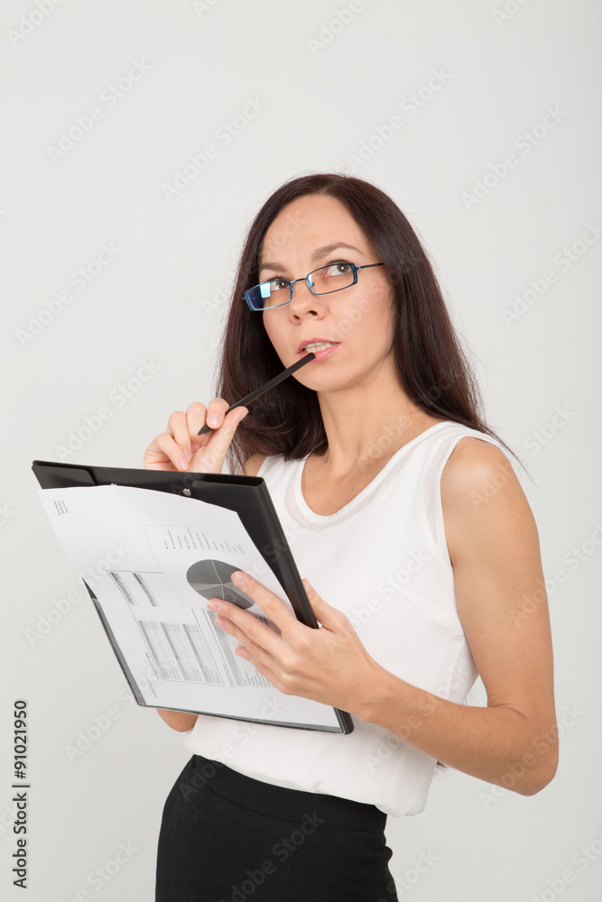concerned brunette business lady with paper clip board concerned brunette business lady with paper clip board