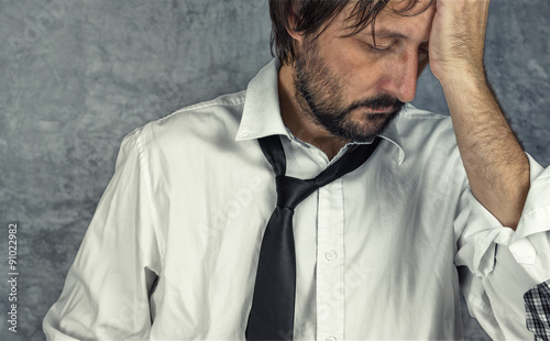 Tired exhausted businessman in trouble
