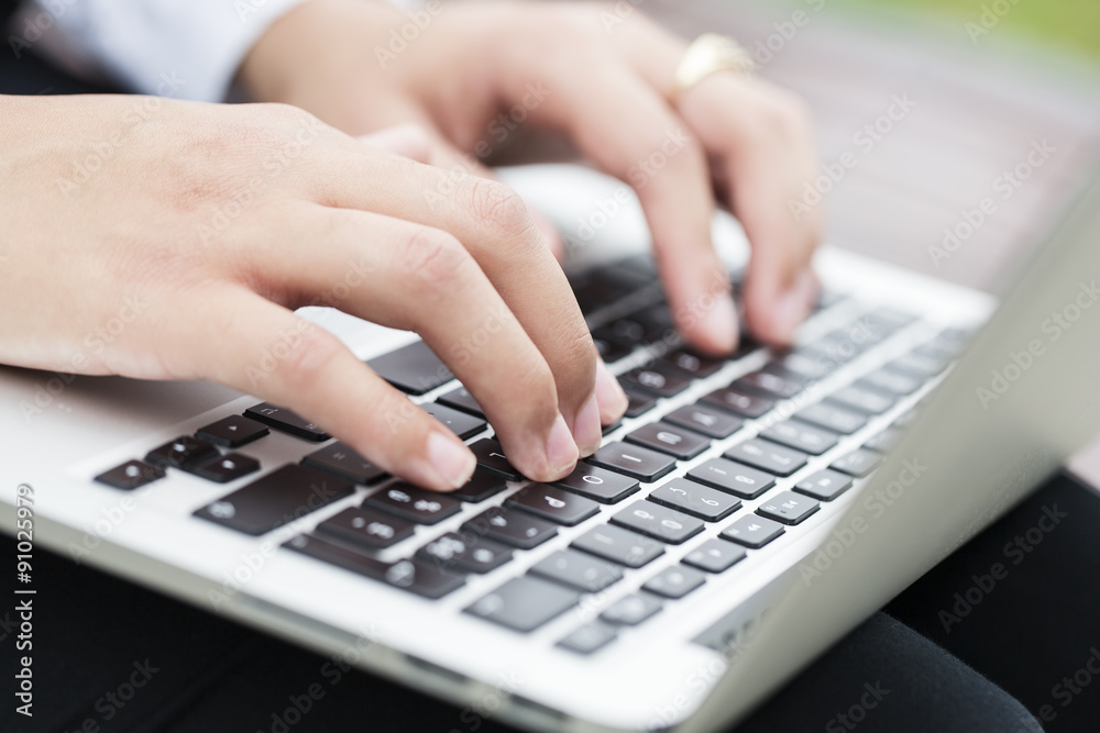 Woman fingers typing on keyboard Woman fingers typing on keyboard