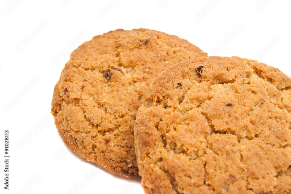 Two fresh oatmeal cookies on white Two fresh oatmeal cookies on white