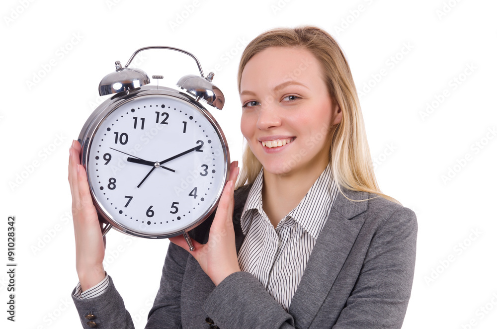 Businesswoman in gray suit holding alarm clock isolated on white Businesswoman in gray suit holding alarm clock isolated on white