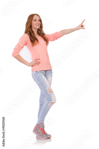 Cute smiling girl in pink blouse and jeans isolated on white