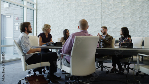 Business people having conference meeting at board room