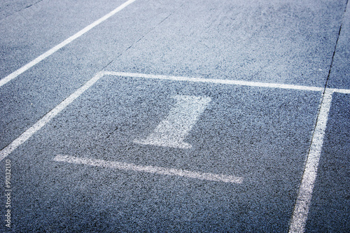 Athletic running track with number one on stadium