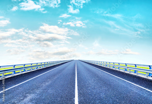 Empty lonely highway goes ahead to horizon