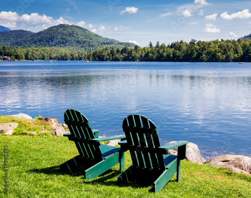 Fototapeta Naklejka Na Ścianę i Meble -  Adirondack chairs. Mirror Lake, Lake Placid New York. Summer, vacation, outdoors, travel, explore, nature, camping, lake and mountain vacation concept