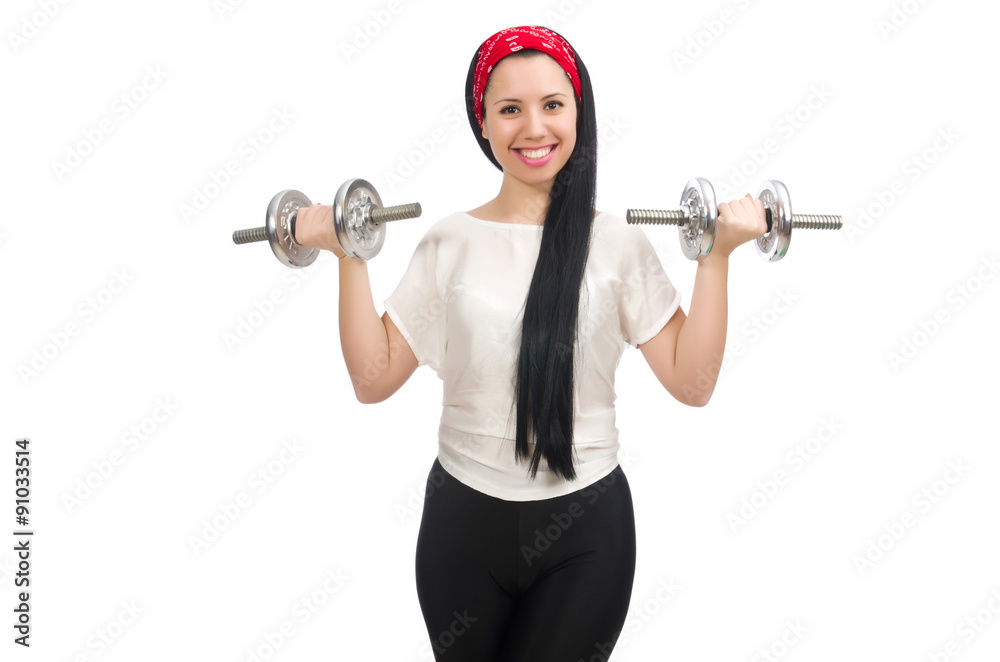 Obraz premium Young woman exercising with dumbbells