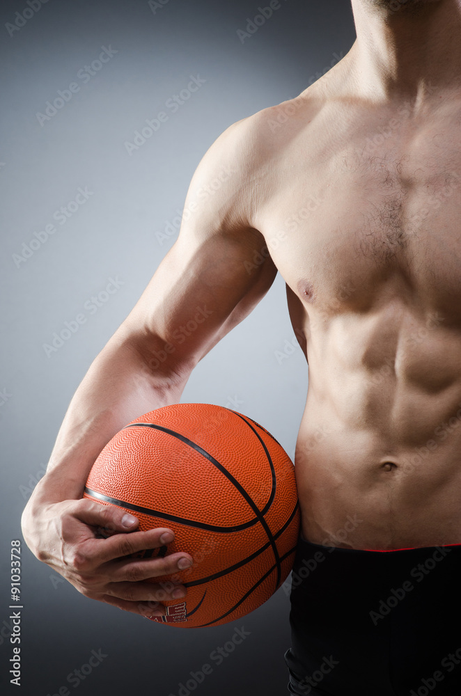 Muscular basketball in sports concept Muscular basketball in sports concept