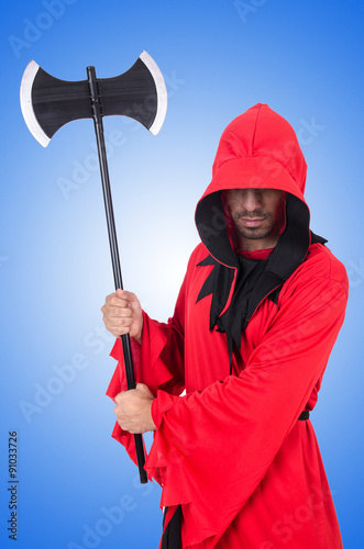 Executioner in red costume with axe on white © Elnur