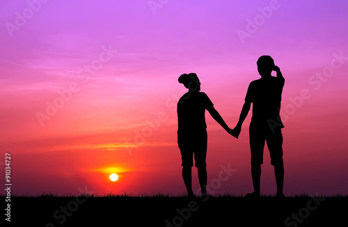 Silhouette of couple at beautiful sunset