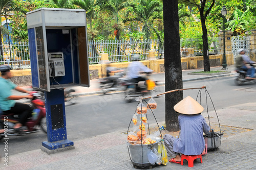 Street vendor on street in Ho Chi Minh city, Vietnam. 