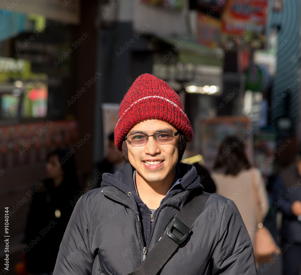Asian male in winter chilling out in city Asian male in winter chilling out in city