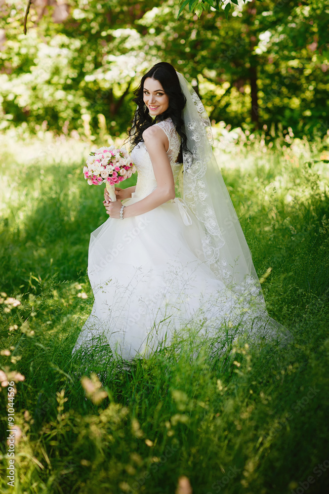 Beautiful happy young brunette bride outdoors in wedding dress,hairstyle, make-up, wedding, lifestyle Beautiful happy young brunette bride outdoors in wedding dress,hairstyle, make-up, wedding, lifestyle