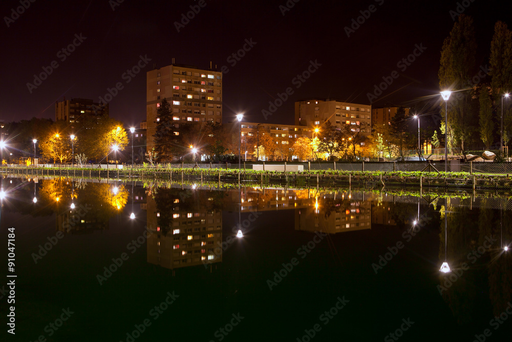 reflection in water of night city Dijon from France 