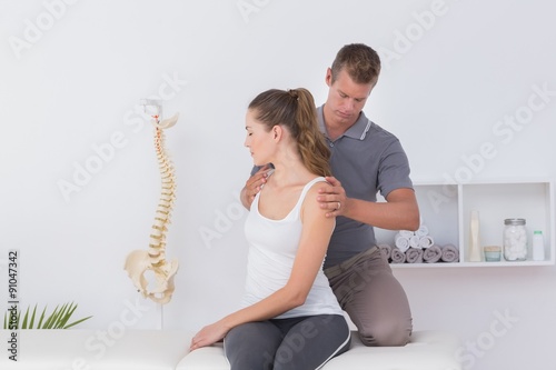 Принти на полотні Doctor examining his patient neck