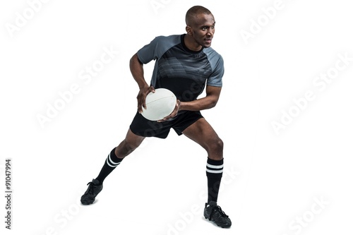 Sportsman in position to throw rugby ball