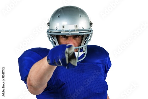 Confident American football player pointing
