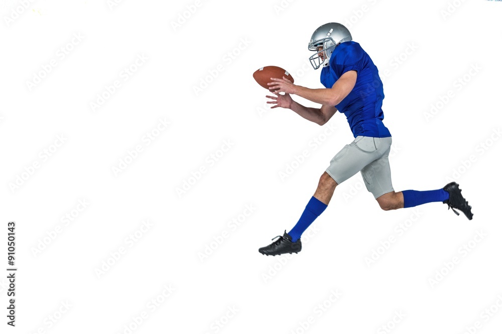 © WavebreakmediaMicro - American football player running while catching ball © WavebreakmediaMicro - American football player running while catching ball