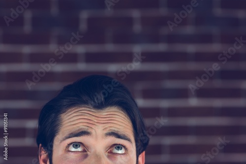 Confused man with raised eyebrows  photo