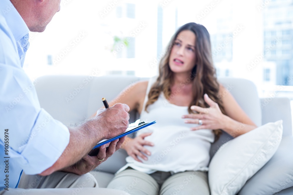 Psychiatrist advising preganant woman Psychiatrist advising preganant woman