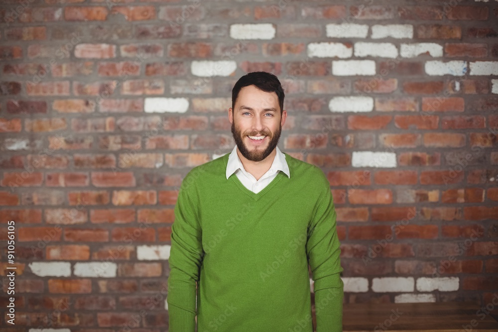Portrait of happy businessman standing against wall Portrait of happy businessman standing against wall