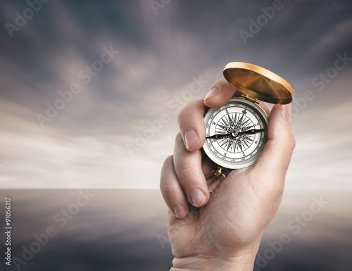 Hands Holding Compass