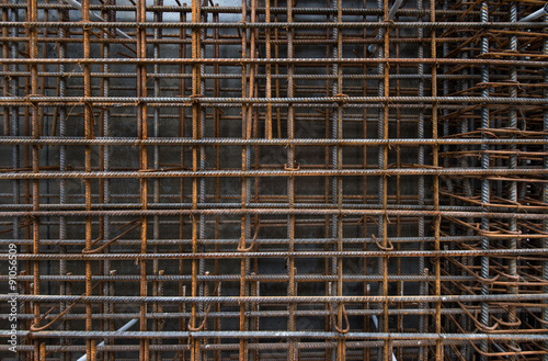 Steel bars reinforcement on construction site  vertical wall  editable background. Formwork used on construction sites for concrete layering.