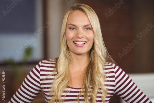 Portrait of cheerful businesswoman in office