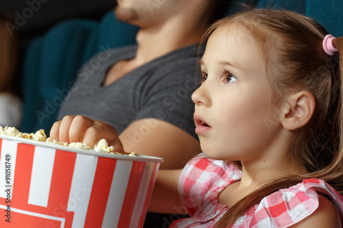 Adorable little girl at the cinema
