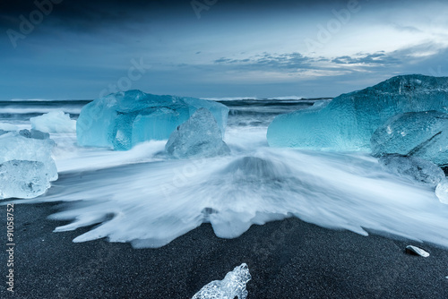 icebergs at crystal black beach in south Iceland