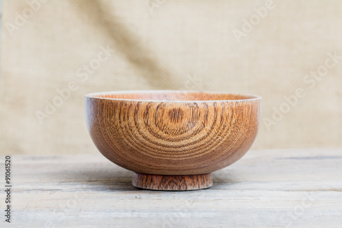 Wood Cup is placed on a wooden floor.