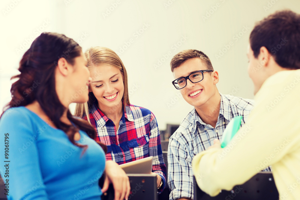 group of smiling students in lecture hall group of smiling students in lecture hall
