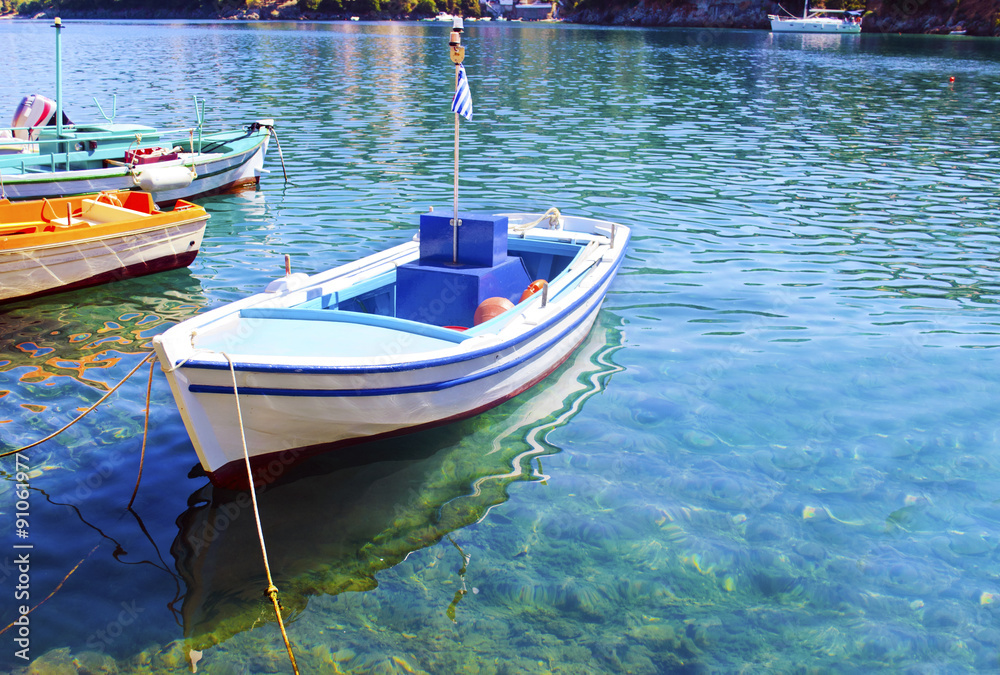 the reflection of a boat on the sea