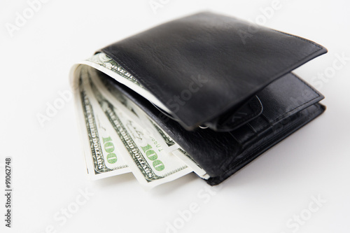 close up of dollar money in black leather wallet