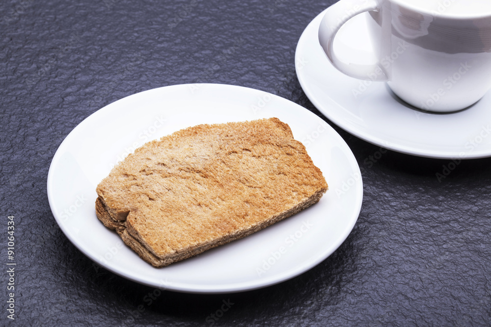Kaya Toast (Asia Snack) on the white dish and table. Kaya is coconut jam and is a well-known snack in Singapore & Malaysia