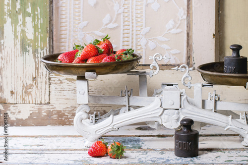 Vintage scales with strawberries photo