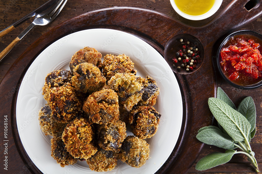 fried eggplant appetizer. vegetarian aubergine balls. with tomat Stock