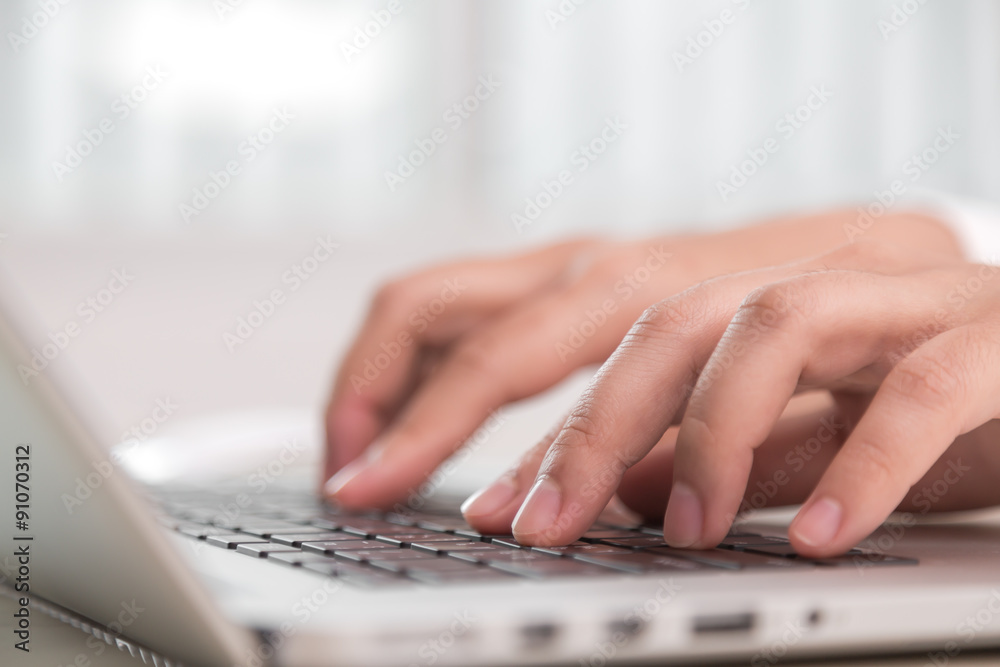 Closeup of business woman hand typing on laptop keyboard Closeup of business woman hand typing on laptop keyboard