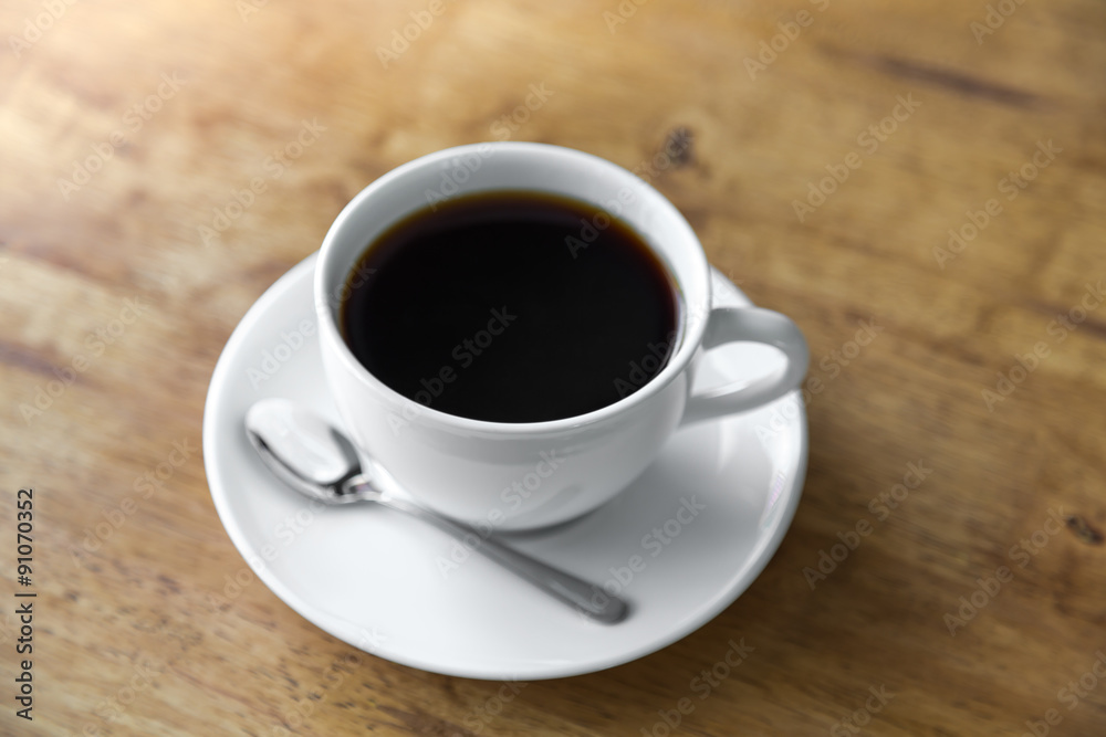Coffee in white cup on wood table Coffee in white cup on wood table