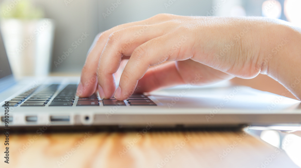 Closeup of business woman hand typing on laptop keyboard Closeup of business woman hand typing on laptop keyboard
