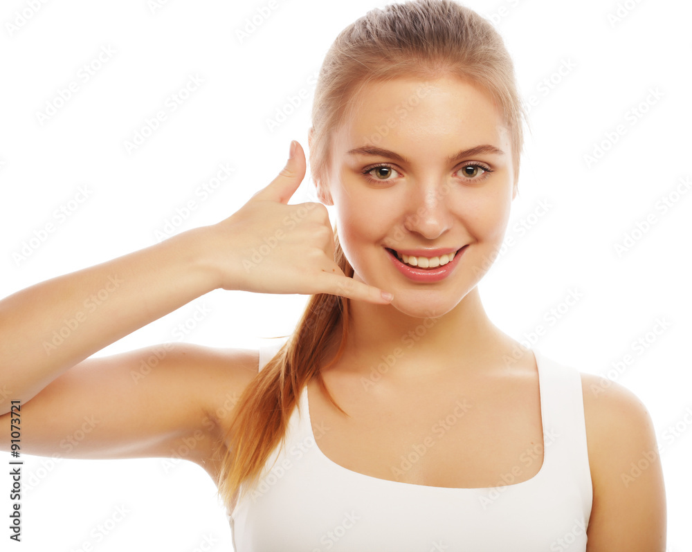 beautiful young woman making a call me gesture beautiful young woman making a call me gesture