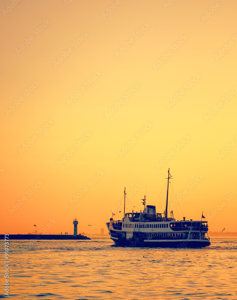 passenger ship at golden sunset