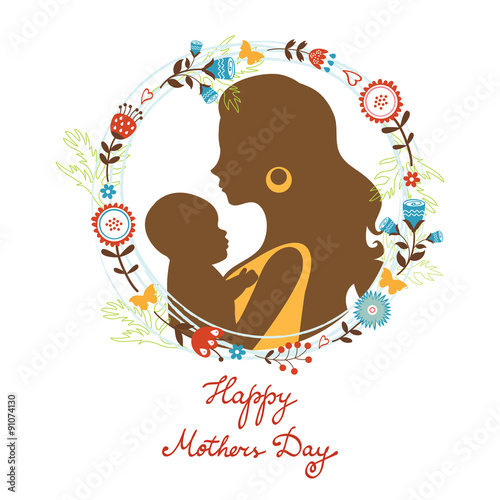 Beautiful mother with her baby silhouettes with floral wreath