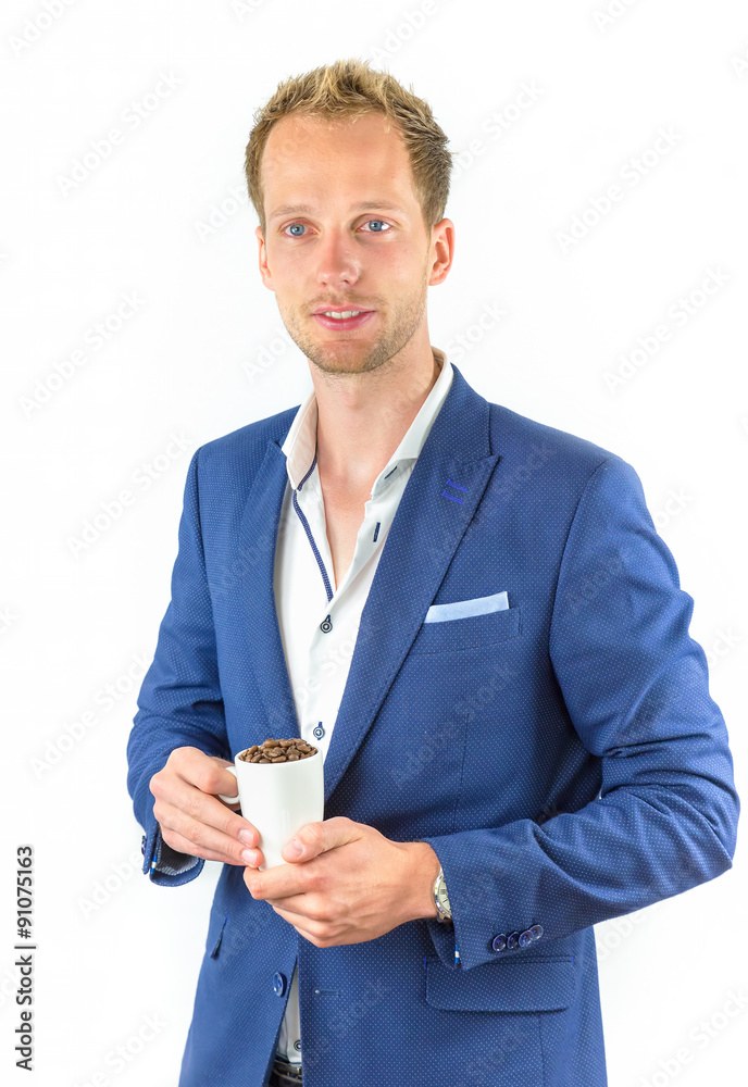 Young salesman promoting coffee beans in cup Young salesman promoting coffee beans in cup