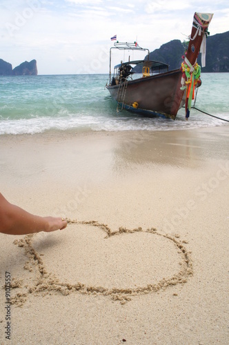 Drawing of heart in the sand