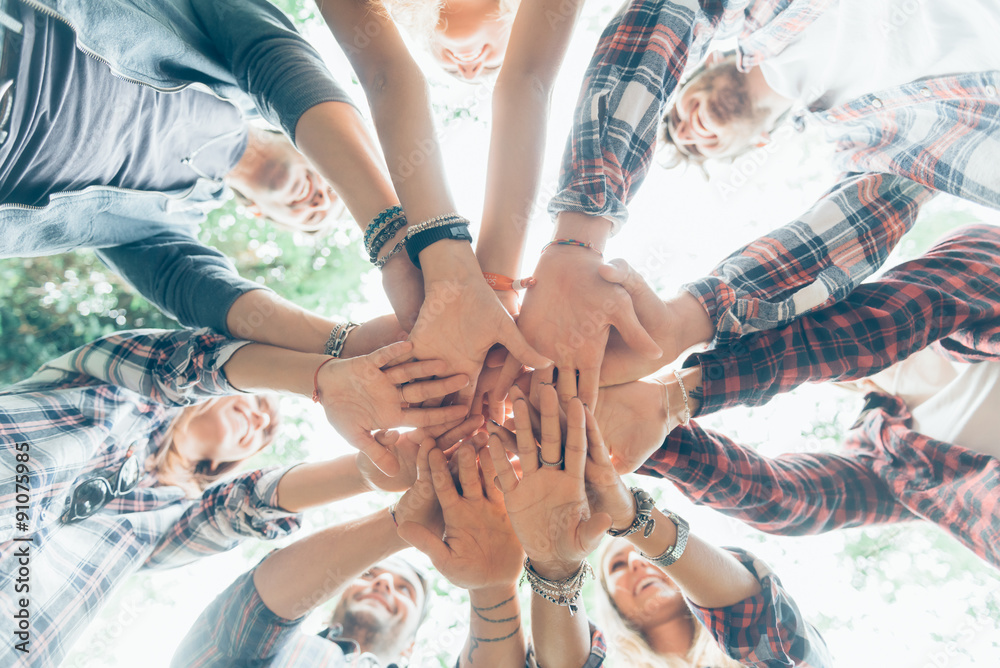 Fototapeta premium Group of Friends with Hands in Stack, Teamwork