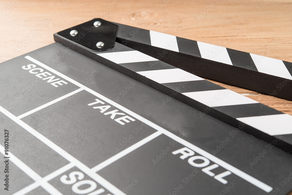 clapperboard on wood