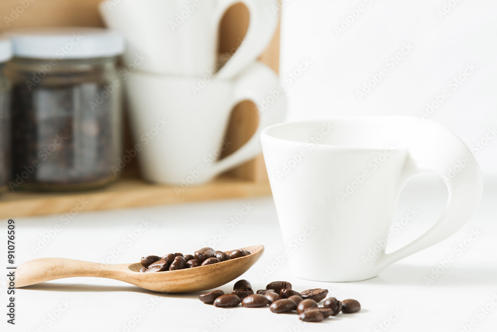 Fototapeta premium Coffee beans and an old wooden scoop