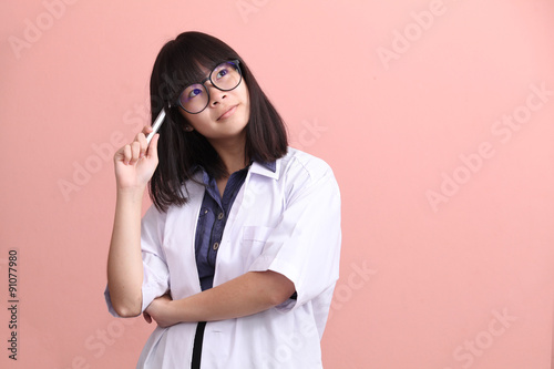 Asian scientist holding pen thinking